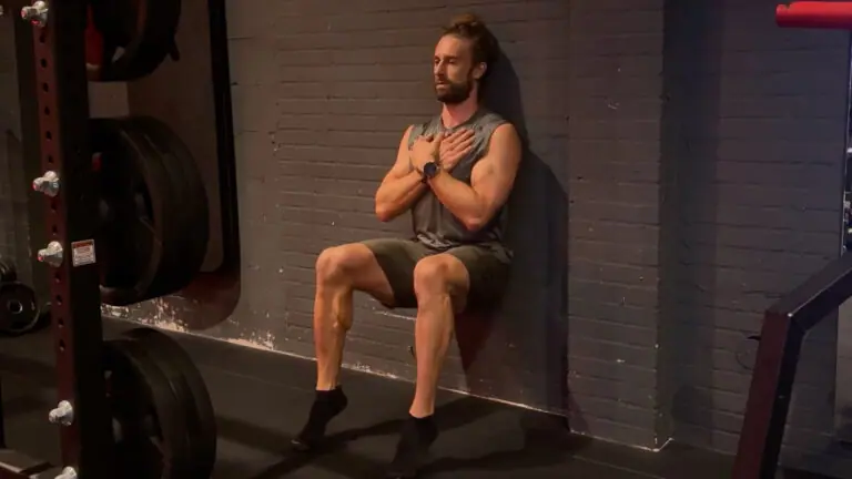 Wall sit calf raise